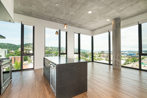 A kitchen with a large island in the middle of the room.