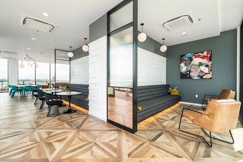 A room with a wooden floor and a glass wall.