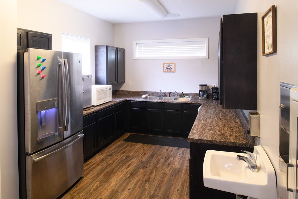 a kitchen with stainless steel appliances and granite counter tops