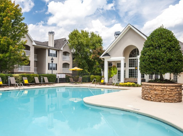 the preserve at ballantyne commons swimming pool with apartment buildings in the background