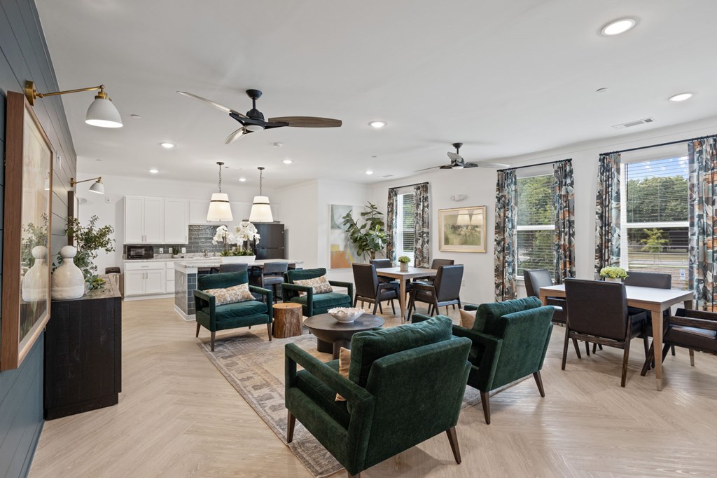 Ovata at Reedy Creek Senior Apartments in Charlotte NC community kitchen with modern appliances and dining room tables