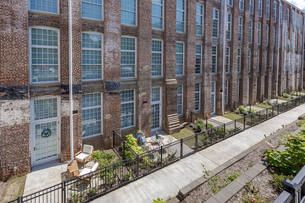 Newry Mill outdoor private apartment patio. Gated in with chairs (chairs not included).