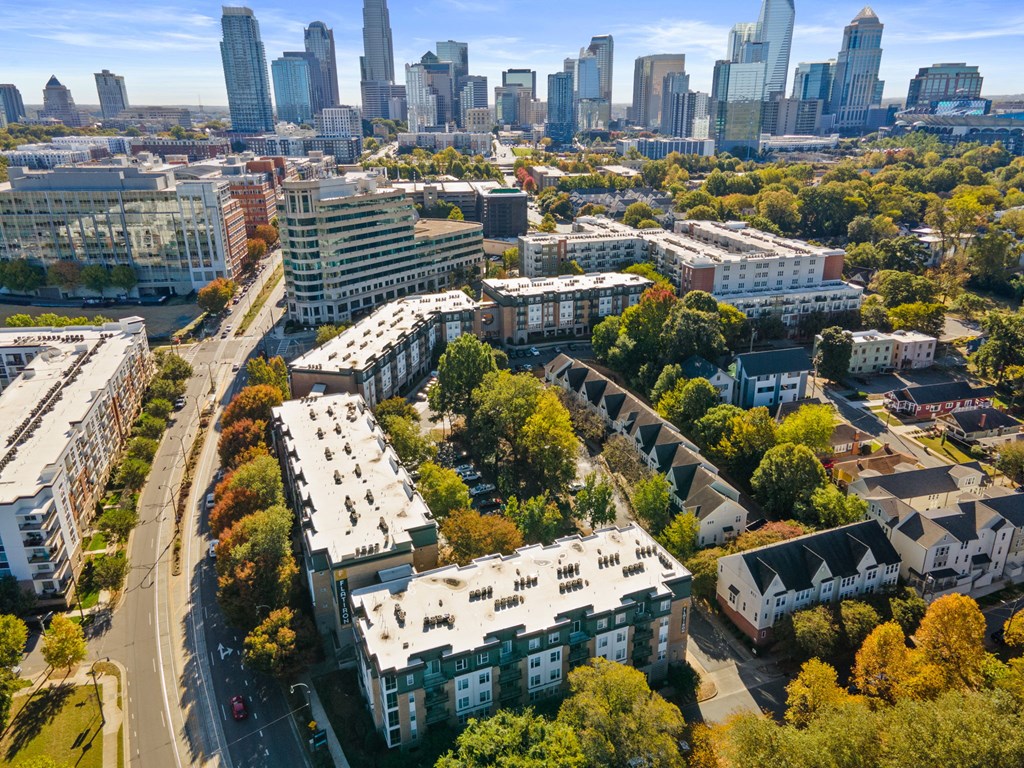 Flatiron West Trade Apartments aerial view with Charlotte skyline in background