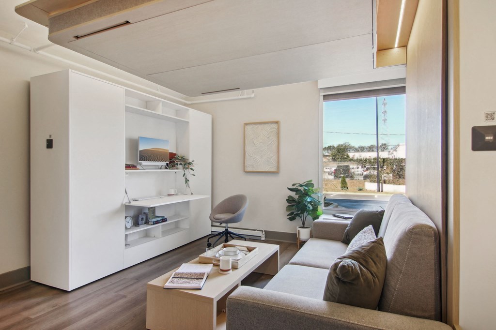 Greenville, SC Studios For Rent | Flathouse Studios | Bedroom with Ori Expandable Bed, Pocket Closet, and Large Window.