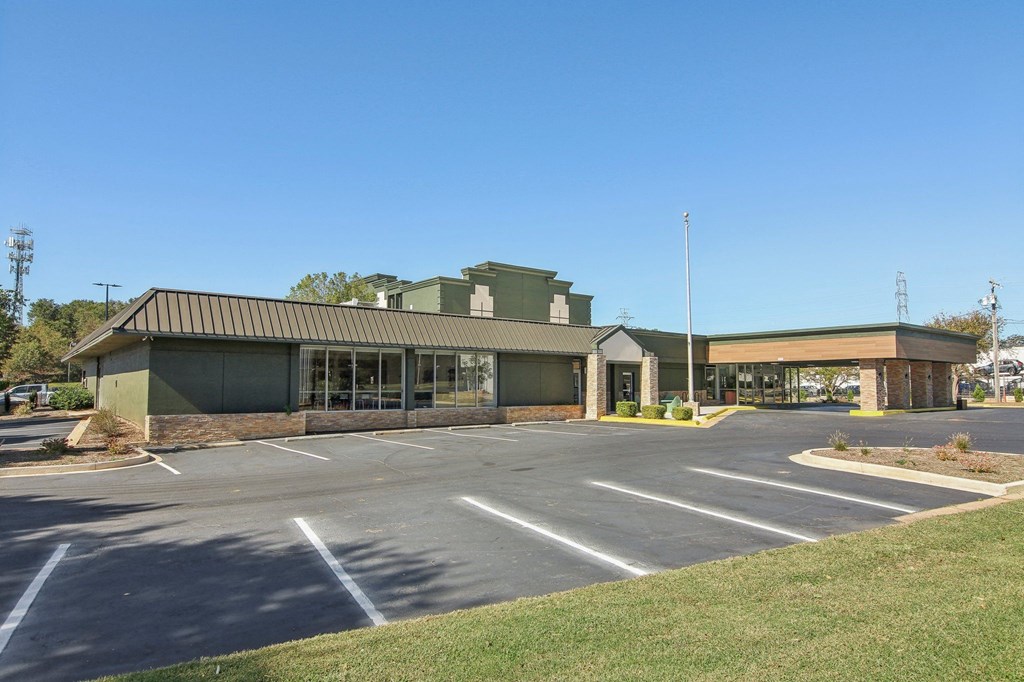 an empty parking lot in front of a building