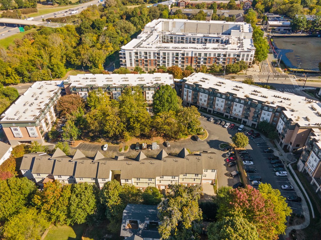 Flatiron West Trade Apartments aerial view with Charlotte skyline in background