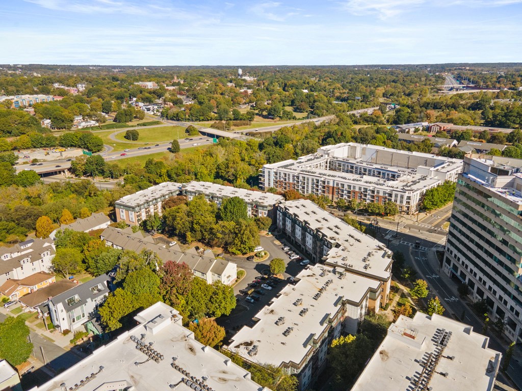 Flatiron West Trade Apartments aerial view with Charlotte skyline in background