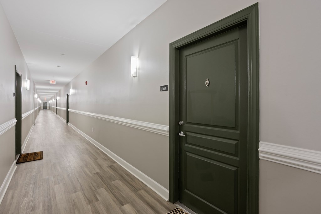 Flatiron West Trade Apartments black door in hallway