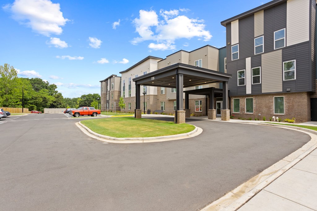 Ovata at Reedy Creek Senior Apartments in Charlotte NC Exterior view of entrance and covered entry drive