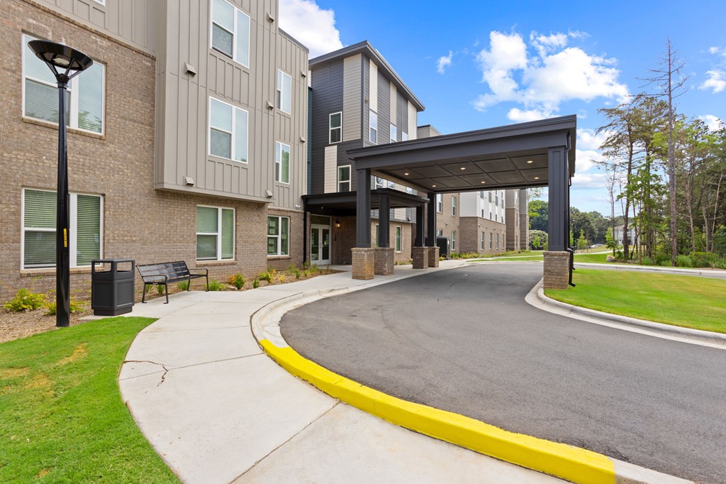 Ovata at Reedy Creek Senior Apartments in Charlotte NC Exterior view of entrance and covered entry drive