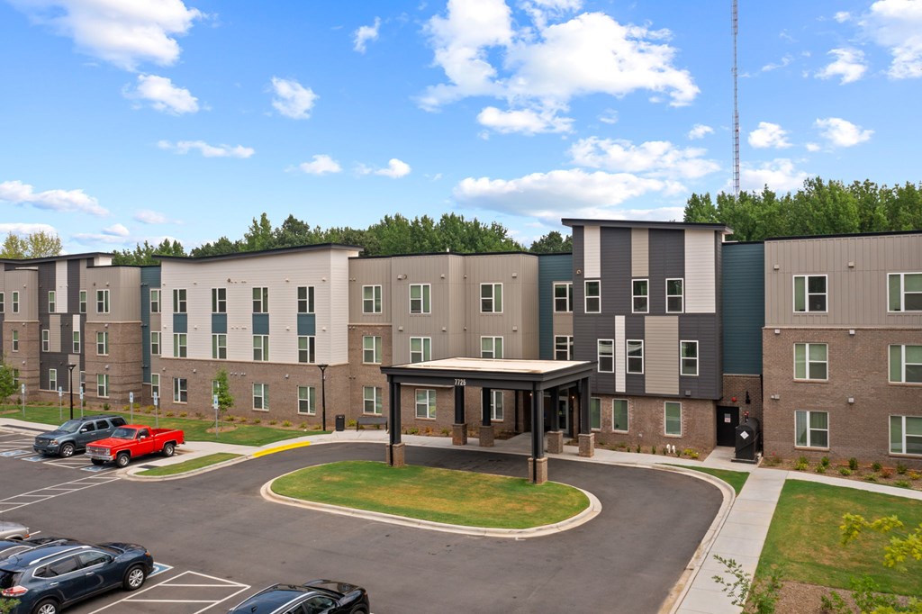 Ovata at Reedy Creek Senior Apartments in Charlotte NC Exterior view of entrance and covered entry drive