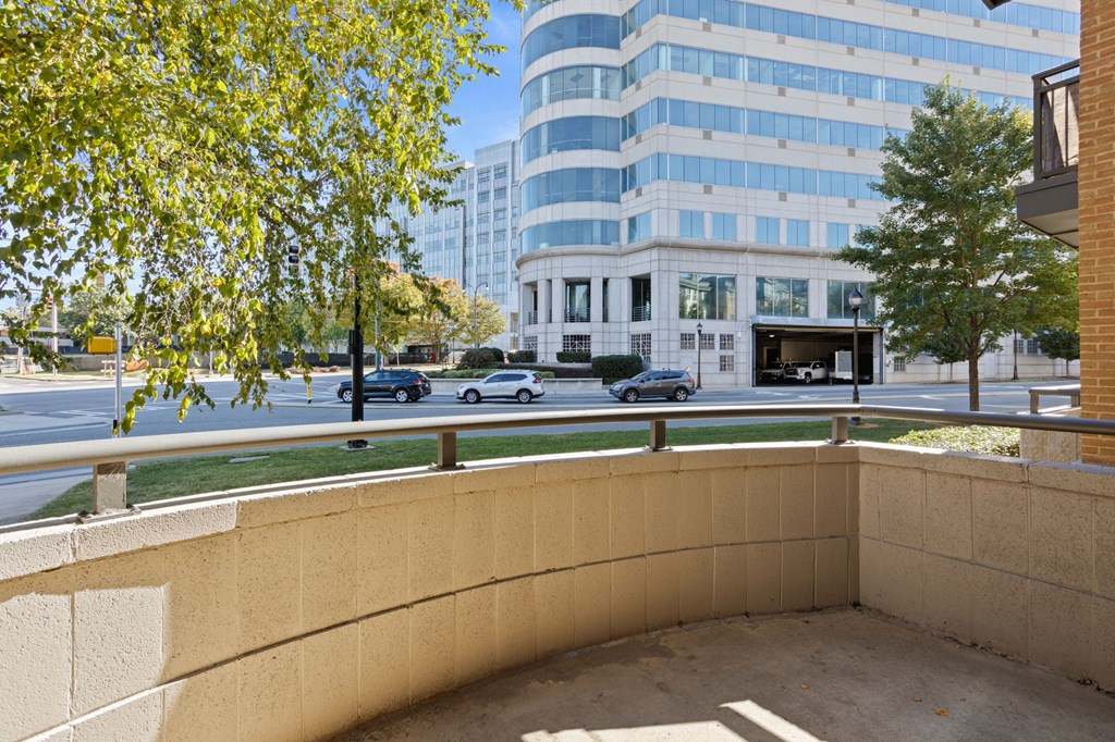 Flatiron West Trade Apartments patio with cement flooring