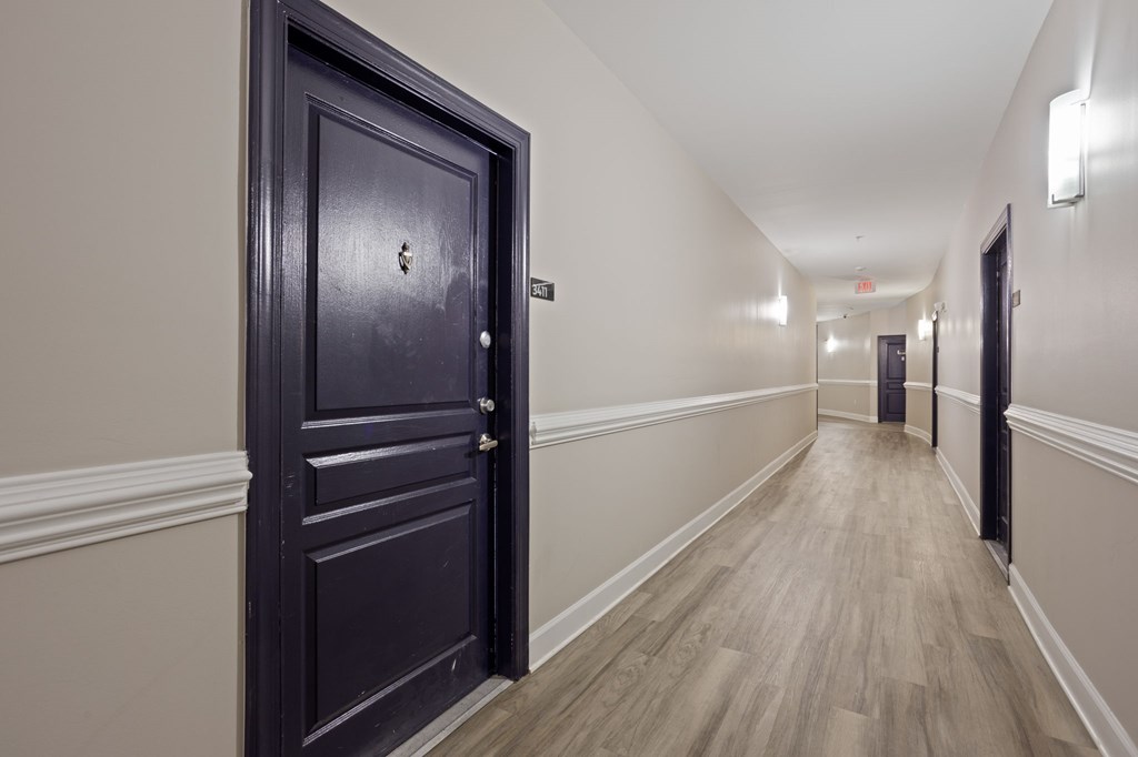 Flatiron West Trade Apartments black door in hallway
