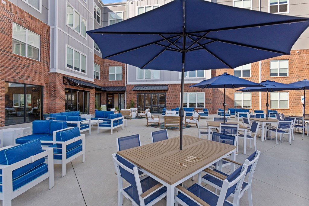 Patio with blue chairs in Park View Greer Apartments in Greer, SC