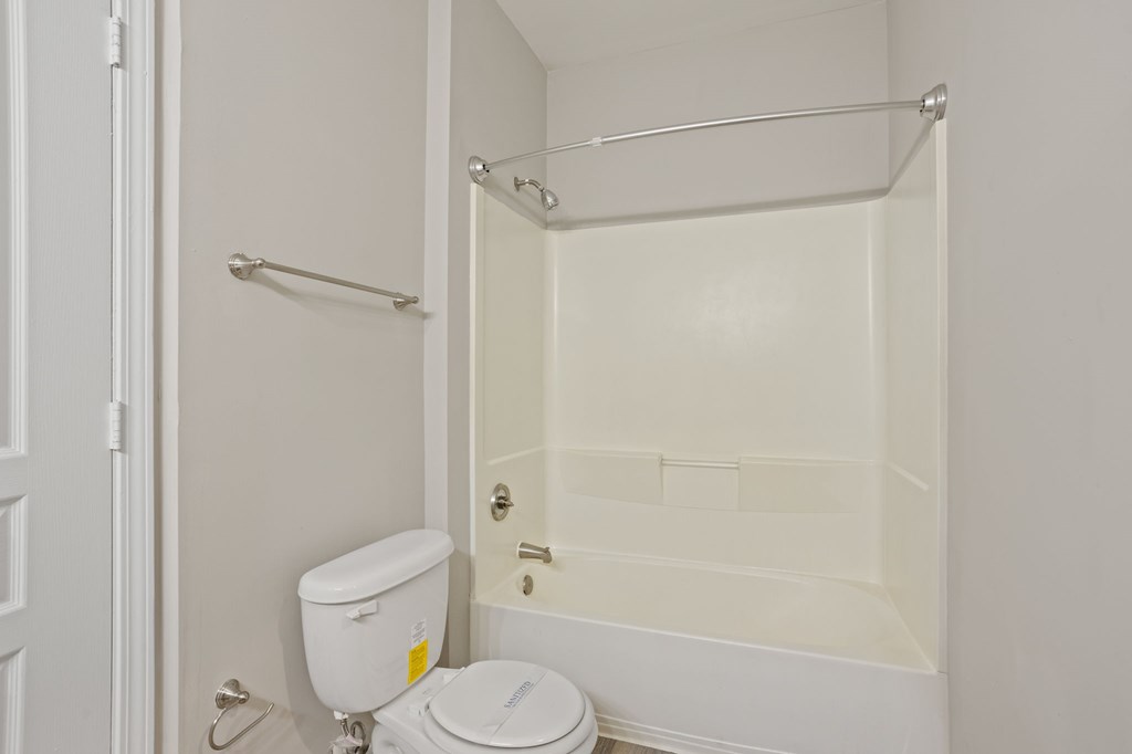 Flatiron West Trade Bathroom with bathtub and shower