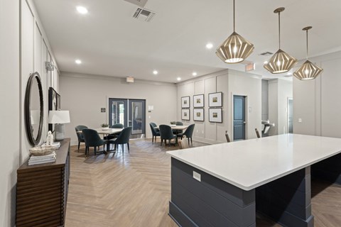 A modern dining room with a large table and chairs.