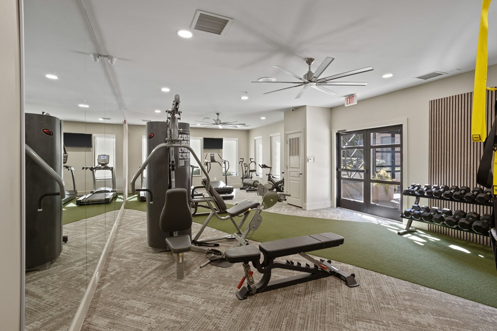 Flatiron West Trade Apartments 24 hour fitness center with free weights, cardio machines, and weightlifting machines