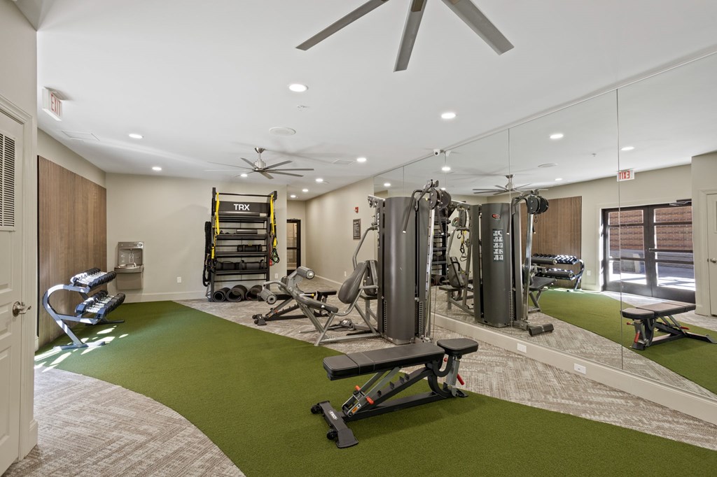 Flatiron West Trade Apartments 24 hour fitness center with free weights, cardio machines, and weightlifting machines