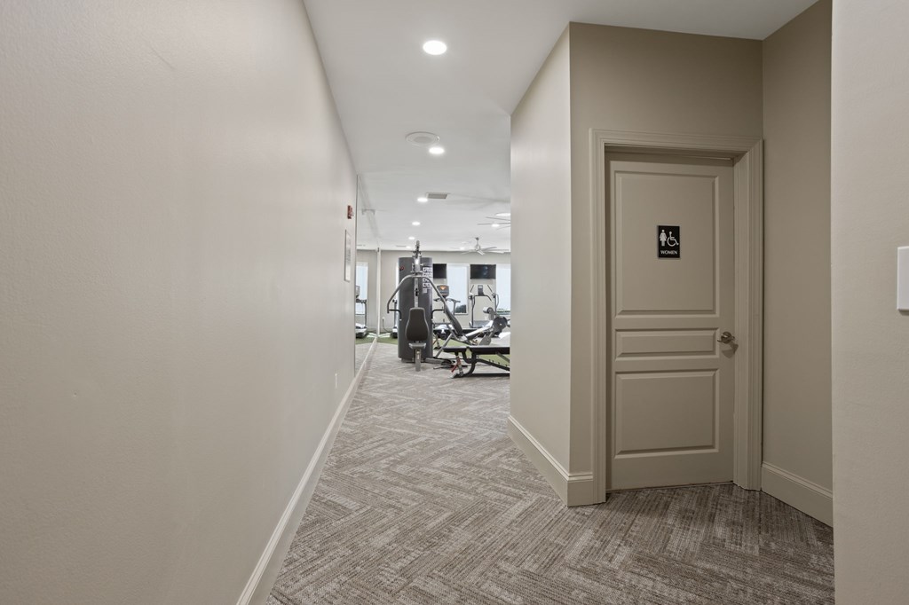 Flatiron West Trade Apartments 24 hour fitness center with free weights, cardio machines, and weightlifting machines
