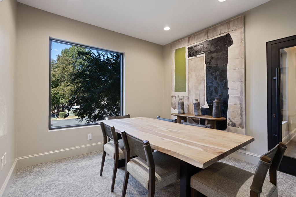 Flatiron West Trade Apartments business center with custom wood meeting table