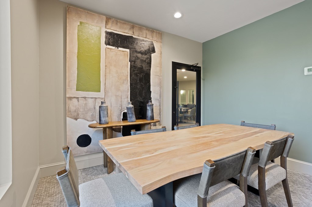 Flatiron West Trade Apartments business center with custom wood meeting table