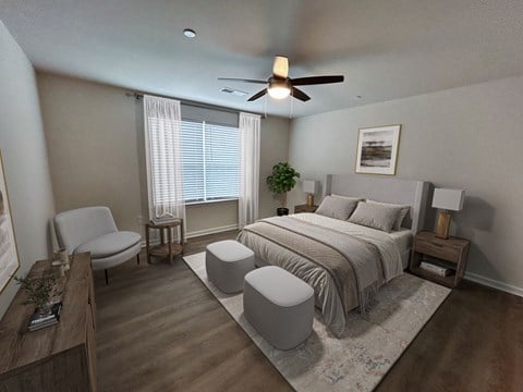 A bedroom with a bed, chair, and window.