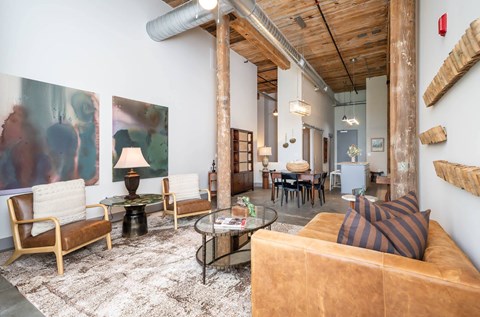 Converse Mill Lofts Luxury Apartments Model Unit Living Room with High Ceilings and Exposed Wood