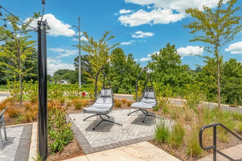 Hanging Chairs outside of the pool at Converse Mill Lofts Apartments in Spartanburg SC