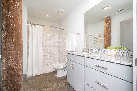 Converse Mill Lofts Luxury Apartments Bathroom with Granite Countertops