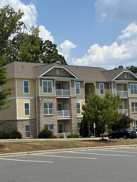 an apartment building on the corner of a street