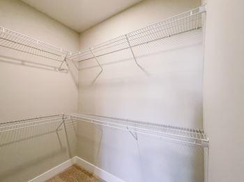 Spacious walk-in closet at Falls at Meehan Apartments