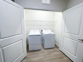 A laundry room with a washer and dryer.