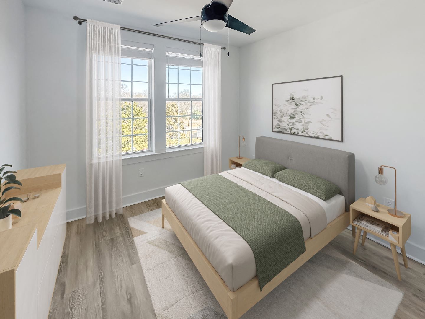 Gordon Street Lofts Bedroom with bed, rug, dresser and floor-to-ceiling curtains.