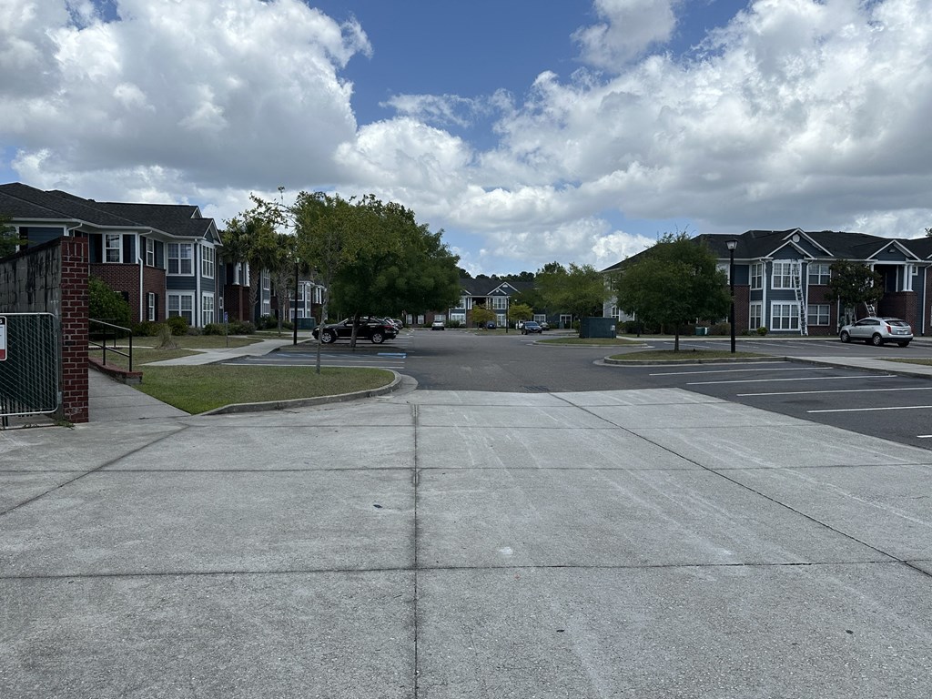 an empty street in a suburban neighbourhood with houses