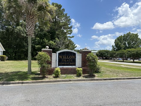 the sign at the entrance of willow ridge apartments