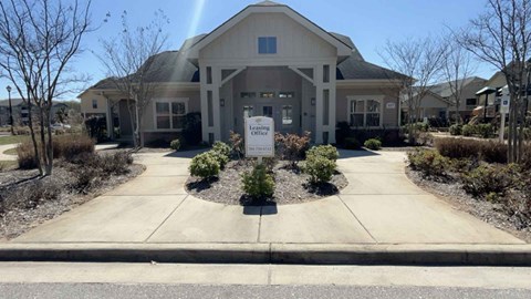 A building with a sign that says "Office" in front of it.