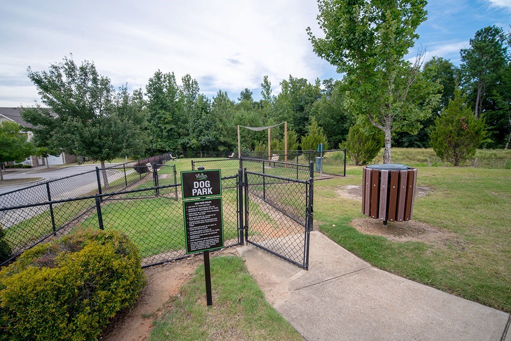 the entrance to the dog park is through a fence