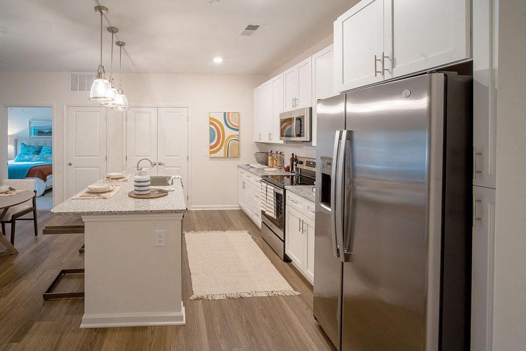 a kitchen with stainless steel appliances and a counter top