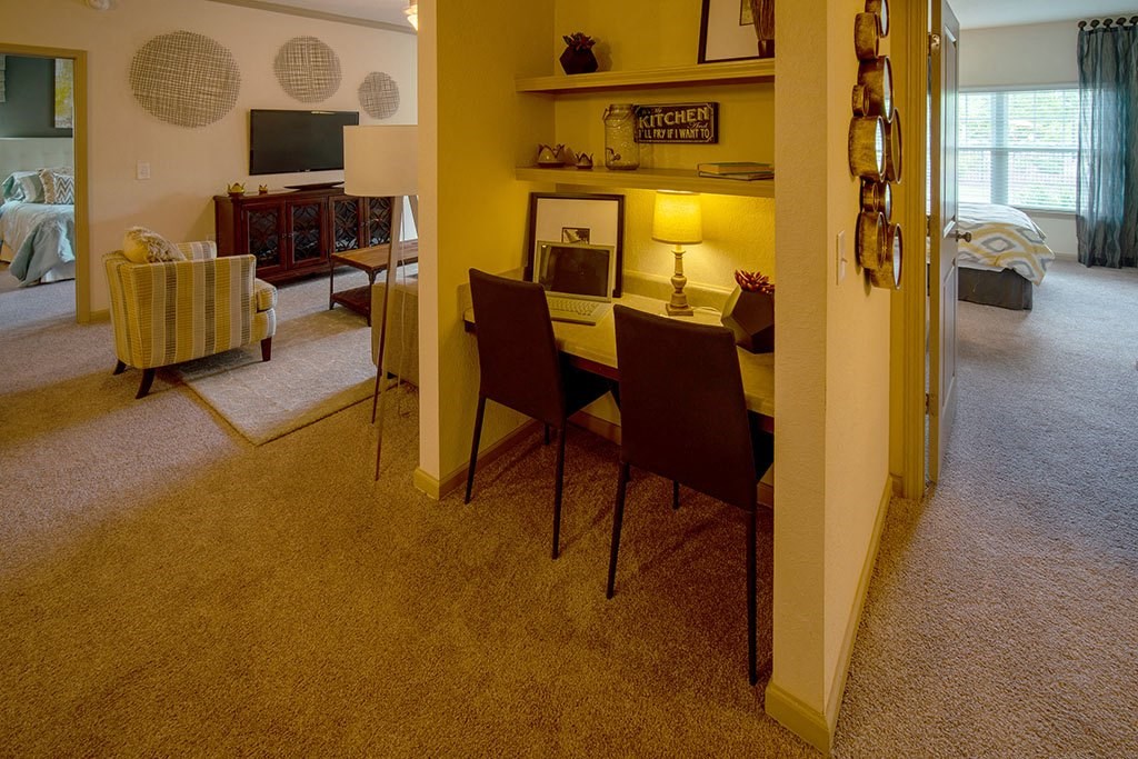 a dining room and living room with a table and chairs