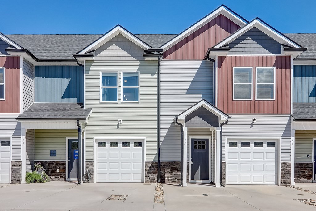 a gray and with two garage doors