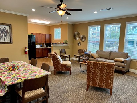 A living room with a dining table and chairs.