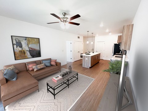 A living room with a brown couch and a coffee table.