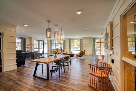 a large kitchen and dining room with a wooden table and chairs