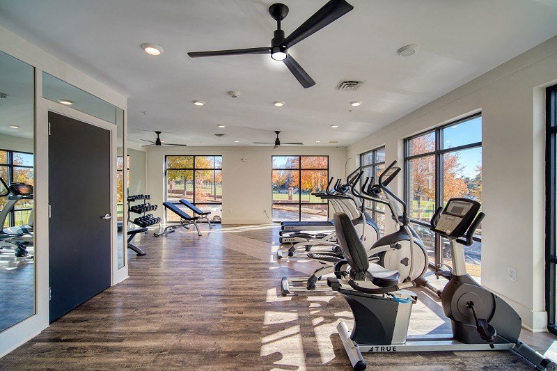 500 Northside Station Apartments Gym with treadmill, ellipticals. a stationary bike and free weights