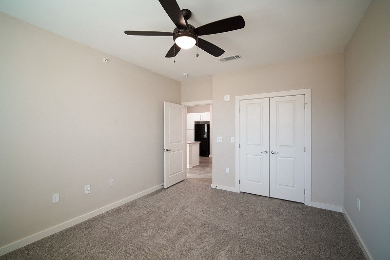 500 Northside Apartments Bedroom, empty with fan