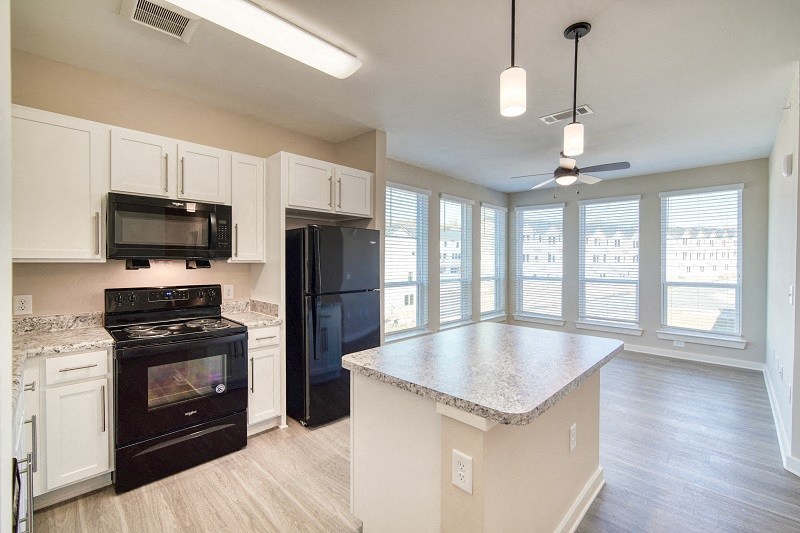 500 Northside Apartments Kitchen, with island, oven, microwave, refrigerator