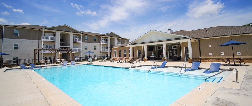 An image of Peachtree Village’s upscale apartments in Boiling Springs, SC. The resort-style pool is visible in the foreground.
