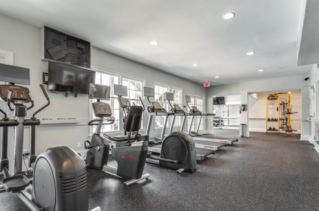 A spacious gym with a variety of exercise equipment.