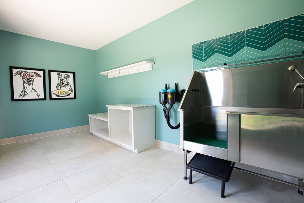 Aventine office space, with teal walls. Very neatly designed.