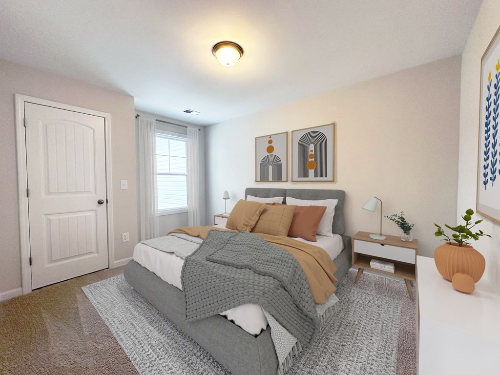 a bedroom with a bed and a white door